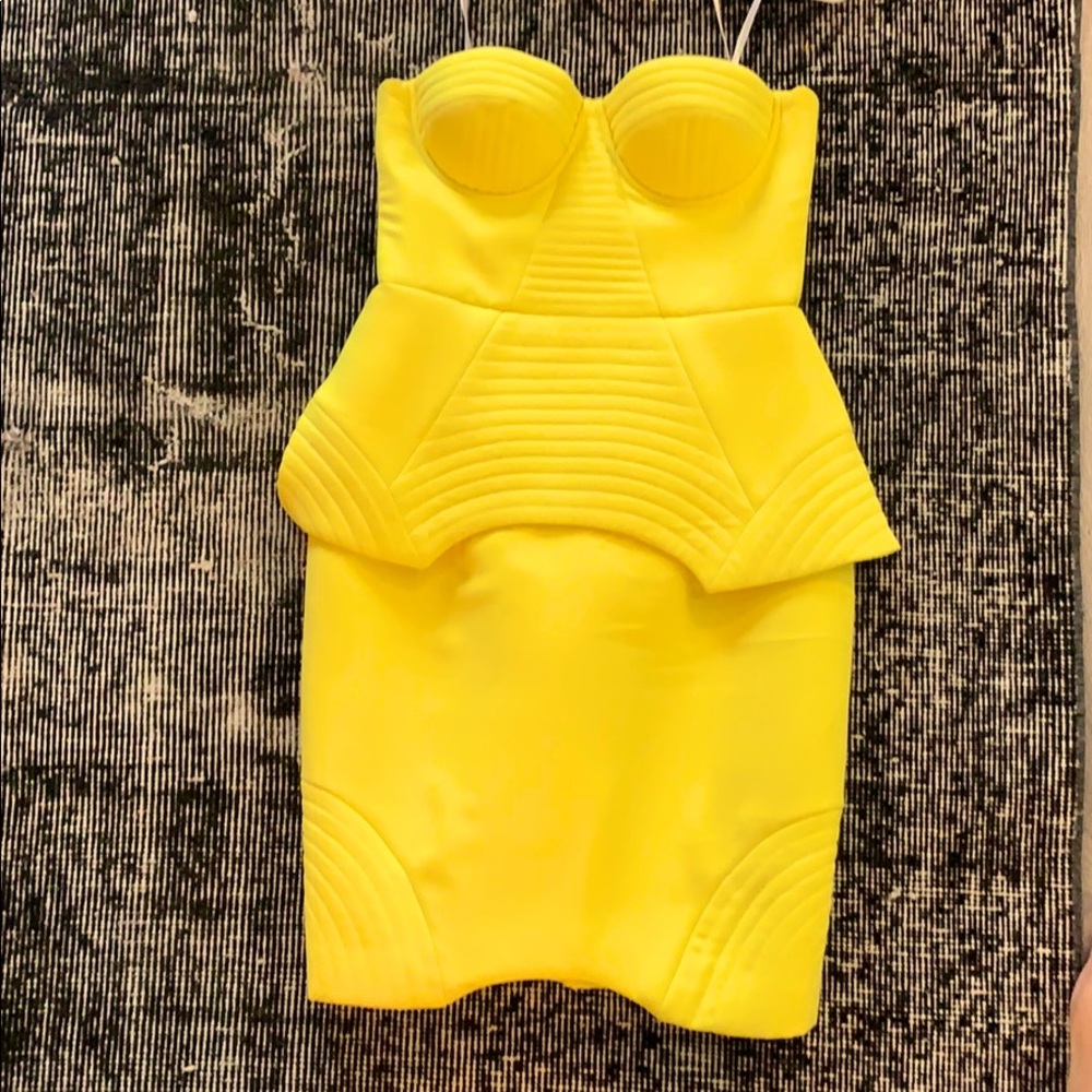 Yellow strapless dress with flattering peplum